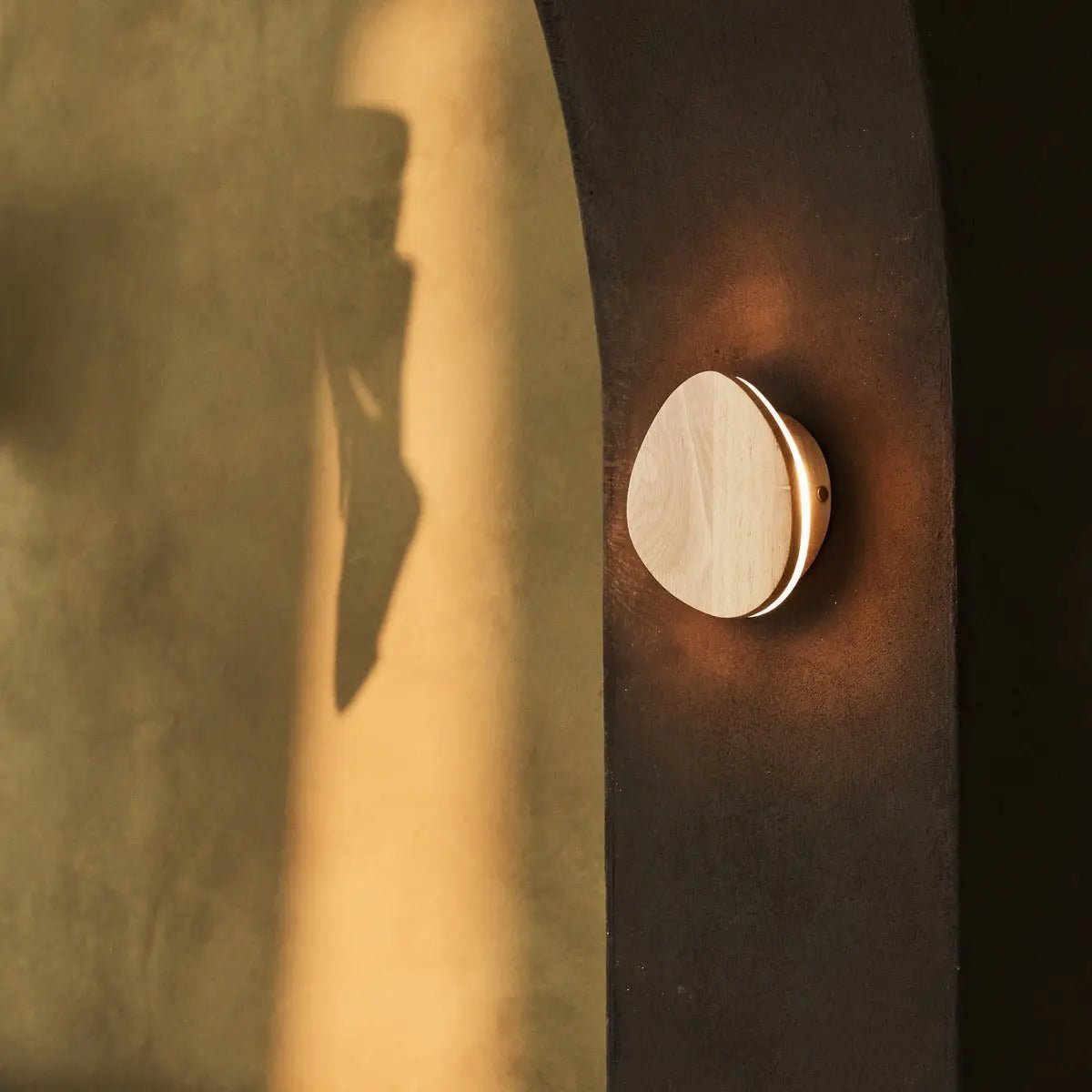 Auralis rechargeable wall lamp warm ambient glow in hallway