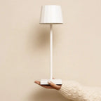 William metal lamp side view showing cylindrical white form
