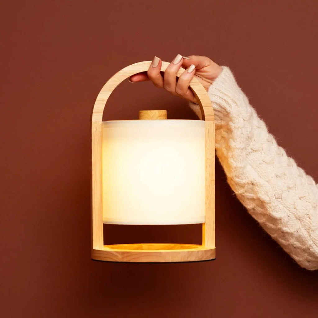 River light wood lamp on bedside table