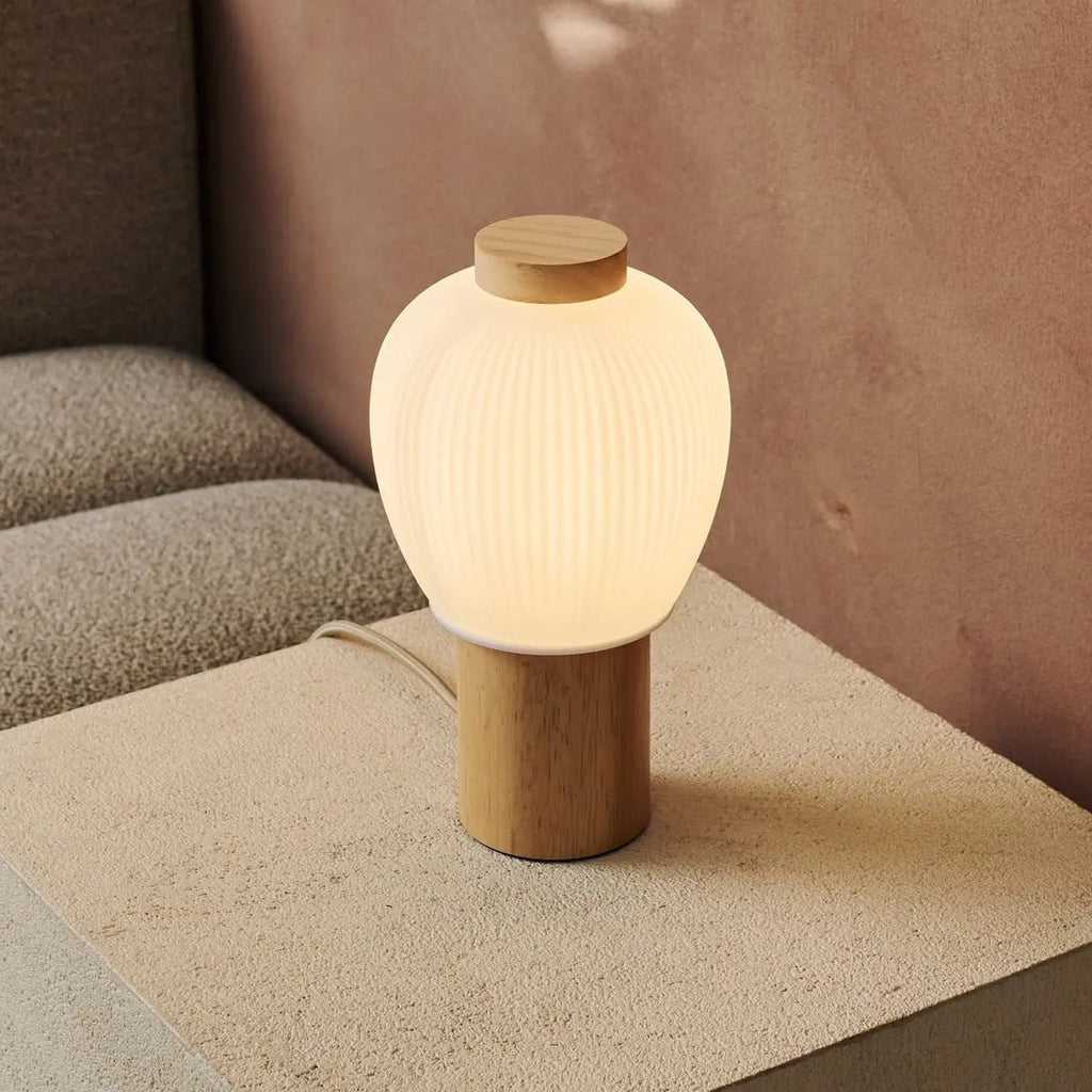 Lot corded lamp side view showing rubberwood base and glass shade
