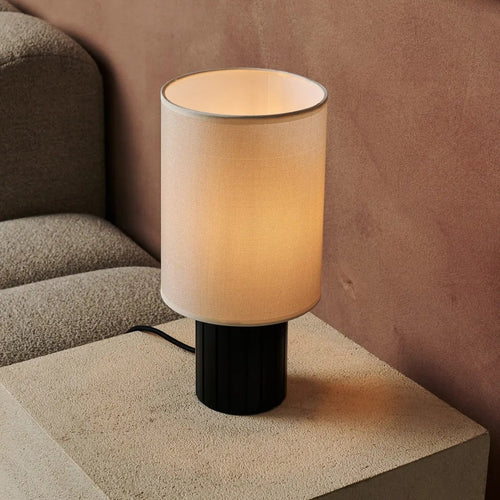 Kiko corded lamp side view showing ribbed base and fabric shade