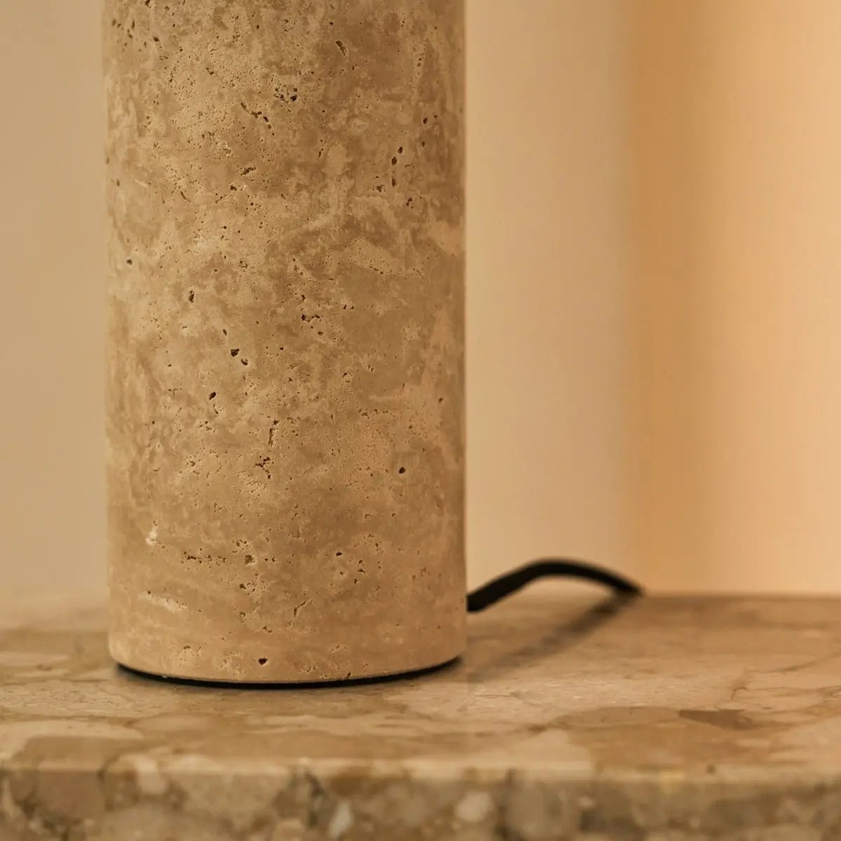 Mavro table lamp close-up of natural travertine texture