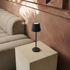 Maya cordless lamp on dining table in ambient light mode