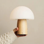 Mia cordless lamp side view showing rubberwood base and linen shade