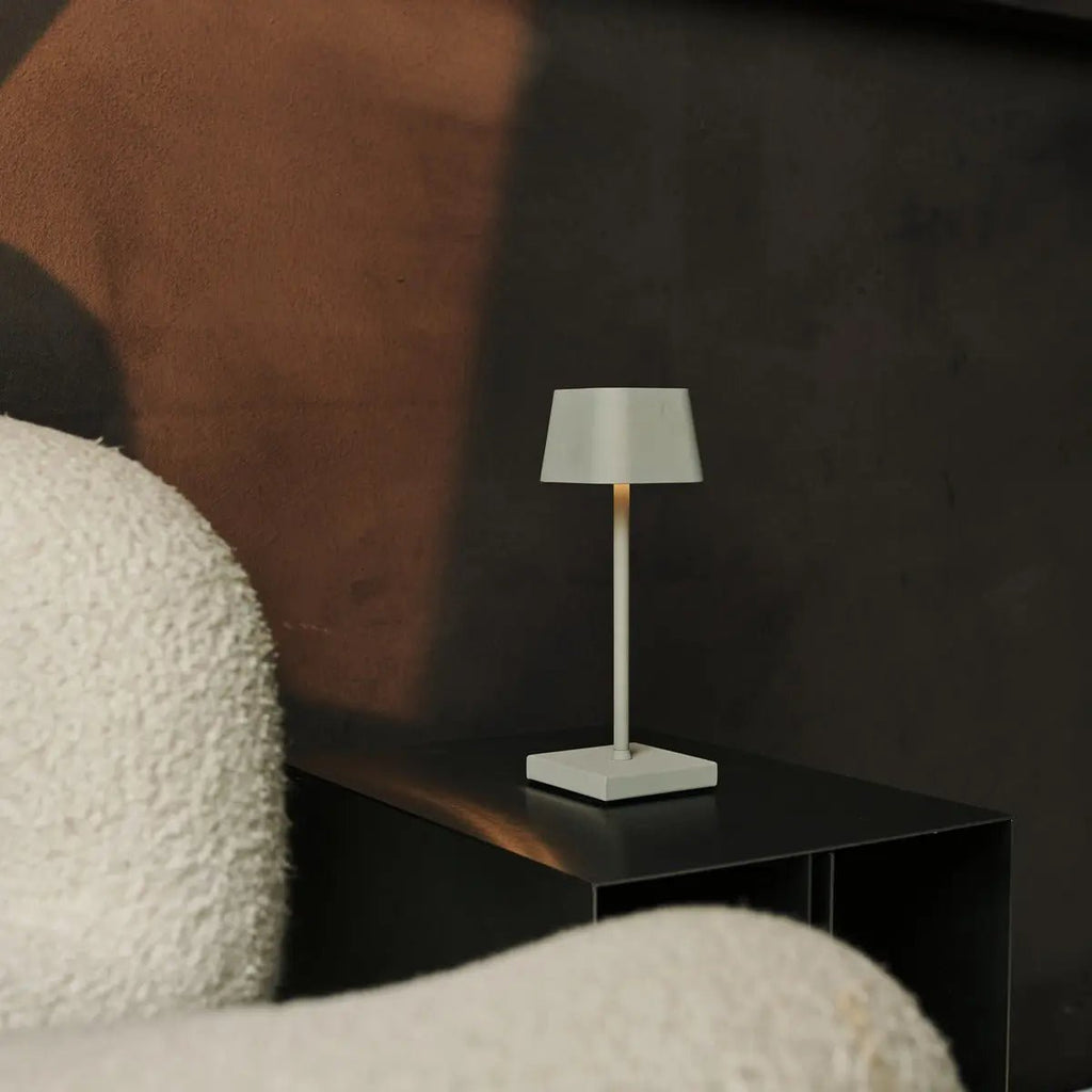 Sarphati shadow grey lamp glowing on restaurant table