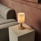 Boris corded lamp side view showing rubberwood base and fabric shade