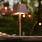 Ava metal lamp side view showing cylindrical mocha brown form