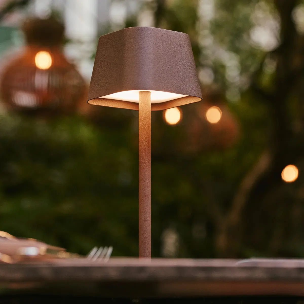 Deka metal lamp side view showing cylindrical mocha brown form