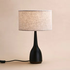 Jacob corded lamp side view showing black rubberwood base