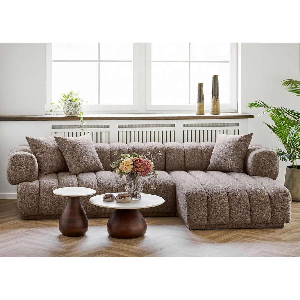 Earthline vase with single stem branch in living room setting