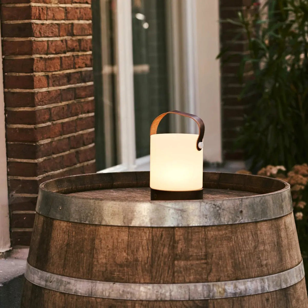 Avery cordless lamp side view showing rubberwood base and leather detail