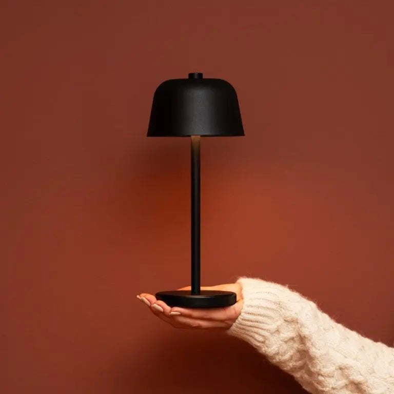 Anton cordless lamp on dining table in ambient light mode