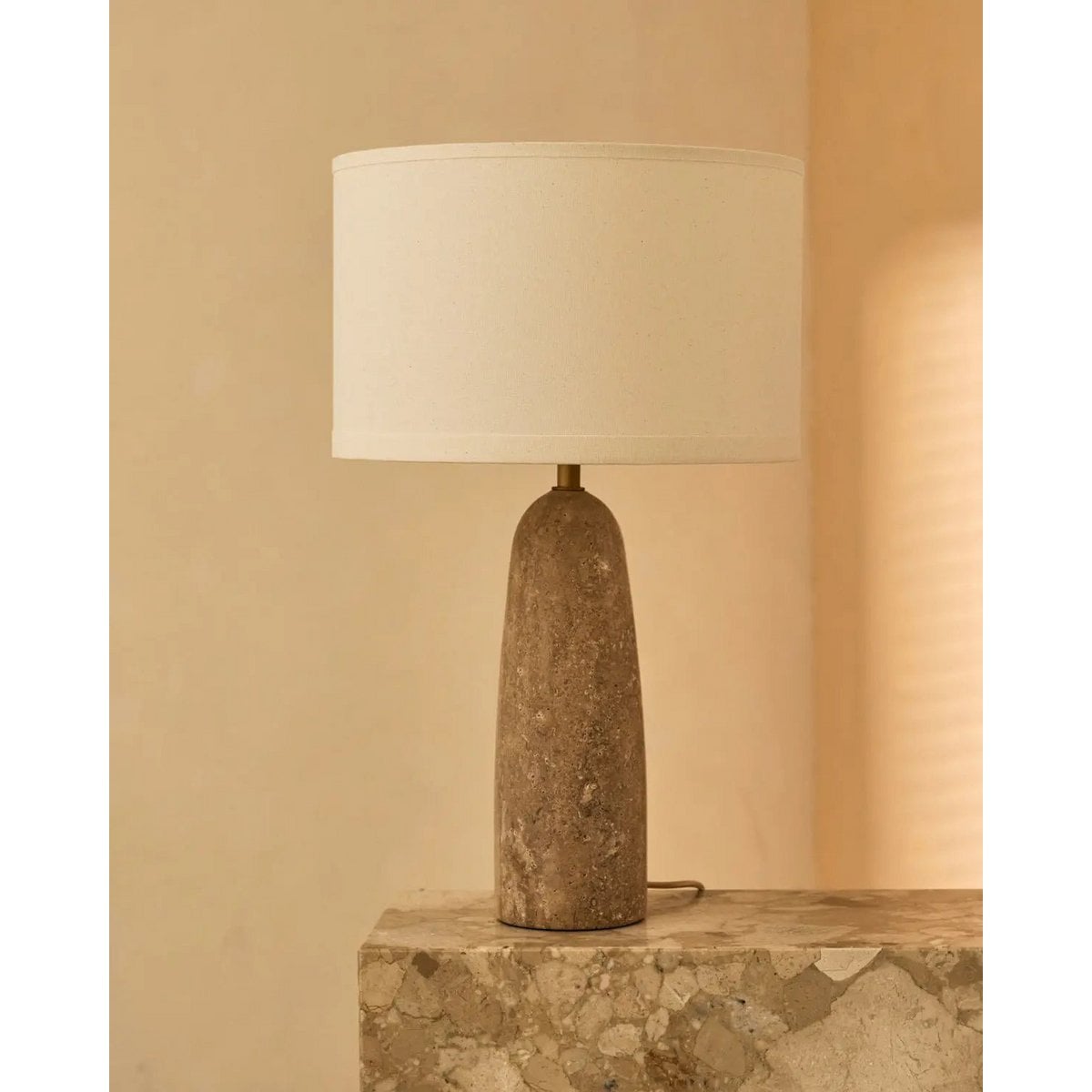 Serena table lamp close-up of natural travertine stone texture