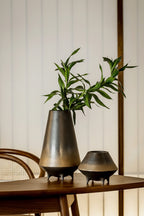 Two ceramic vases with a plant on a wooden table, branded 'Oriental' by Element Accessories.