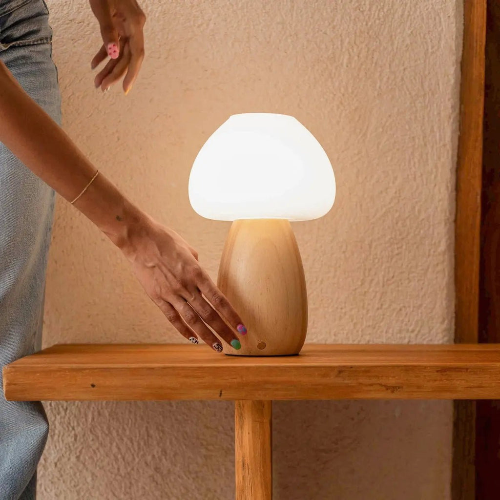 Beer cordless lamp side view showing rubberwood base and matte glass shade