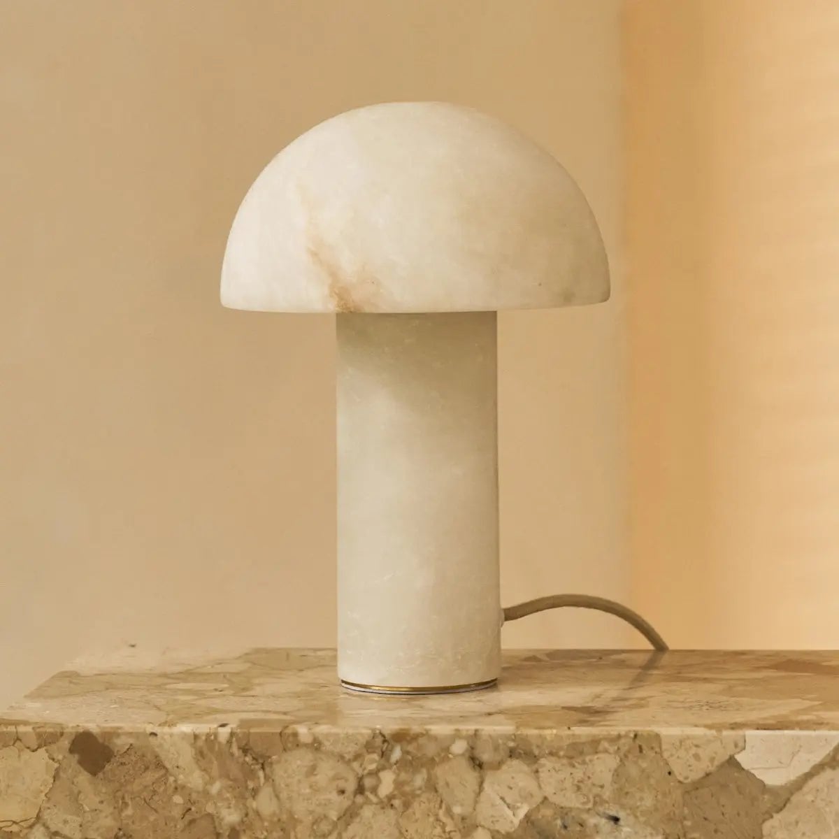 Alba solid alabaster lamp side view showing rounded silhouette