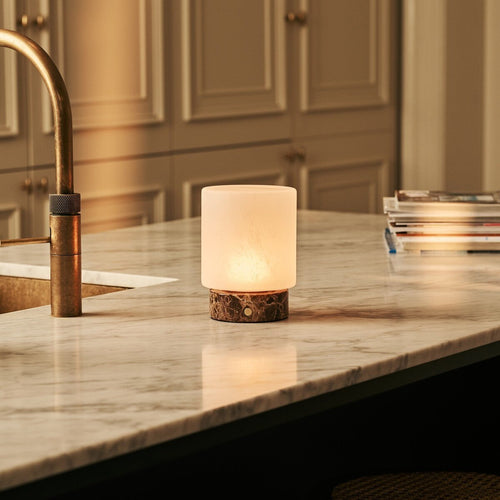 Cuyp marble lamp side view showing dark stone base