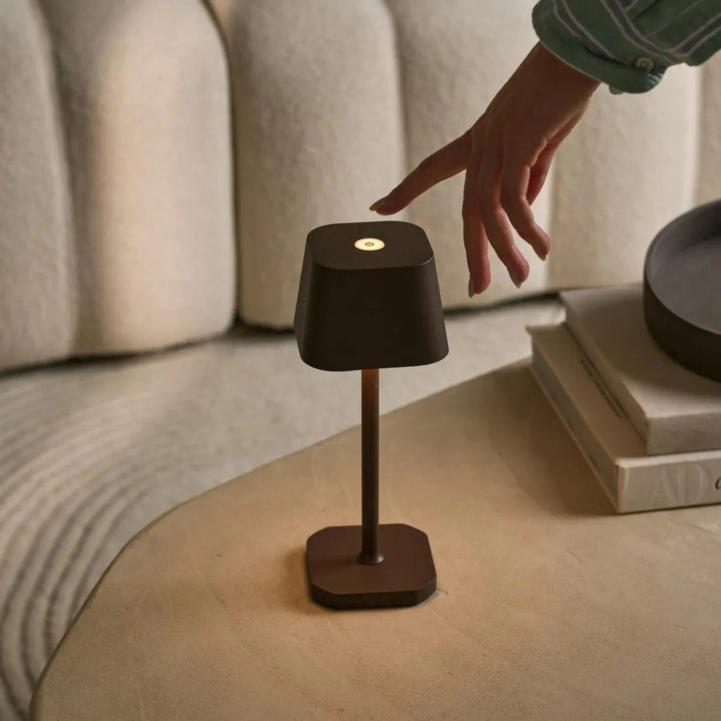 Ava cordless lamp on dining table in ambient light mode