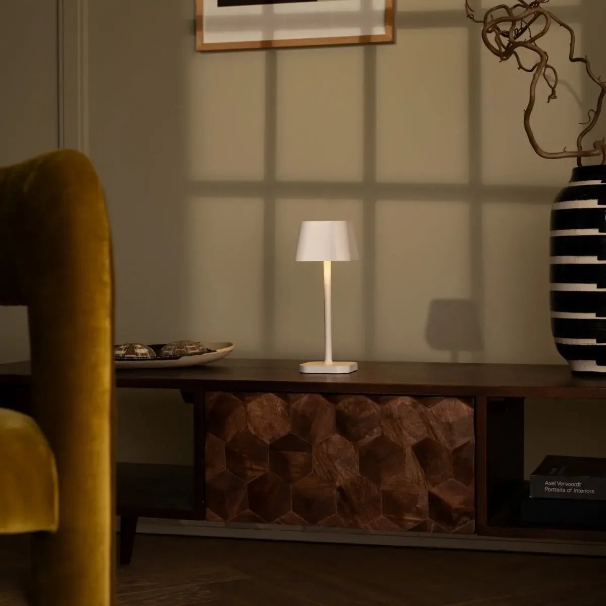 Ava cordless lamp on dining table in ambient light mode