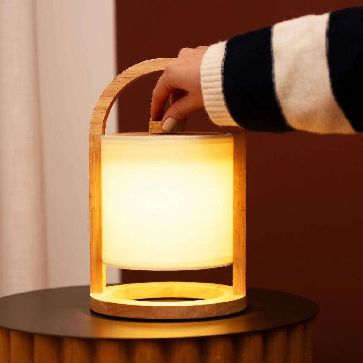 River cordless lamp side view showing light rubberwood and linen shade