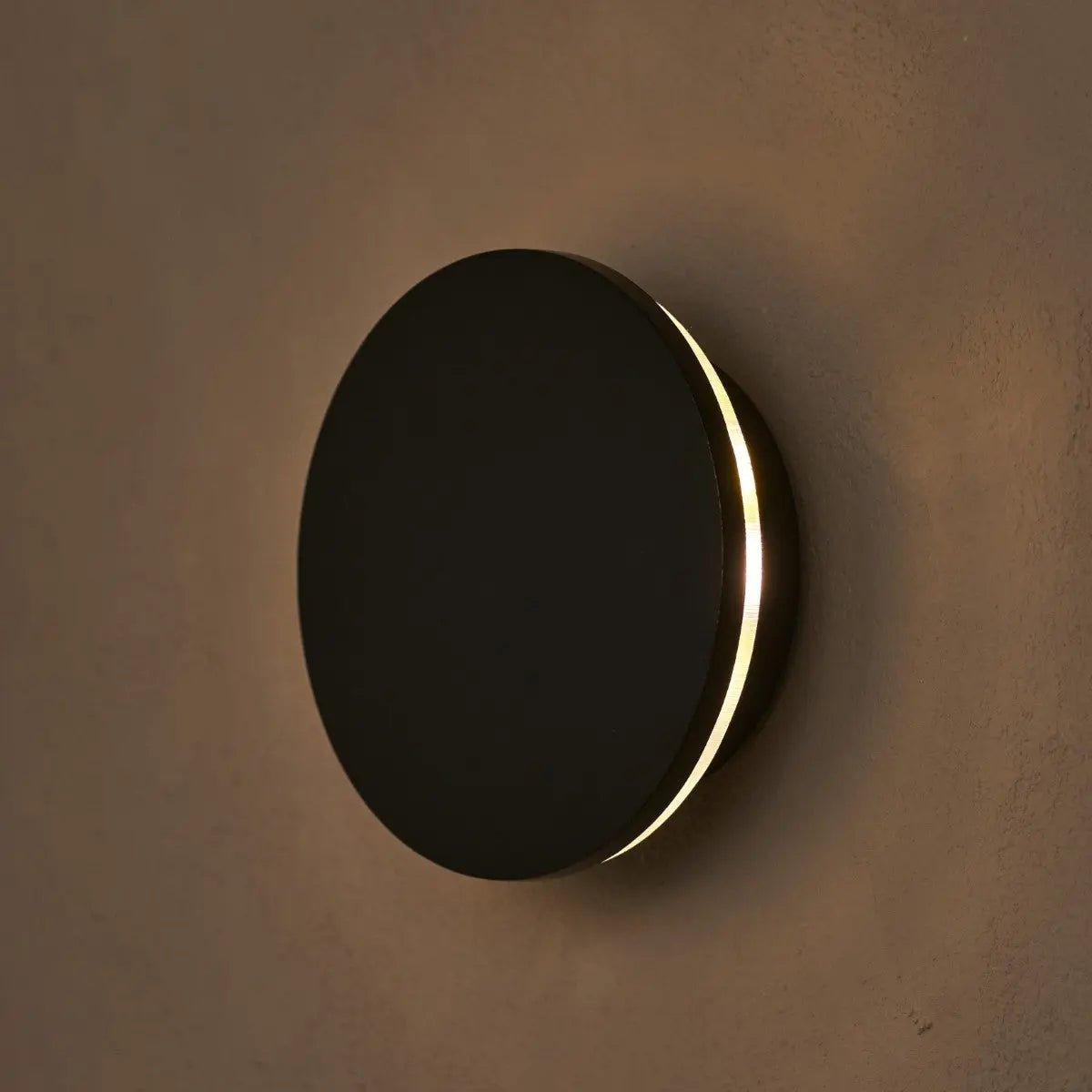 Lou cordless wall lamp mounted in hallway setting