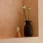 Zavi cordless lamp detail of glass shade and rubberwood base