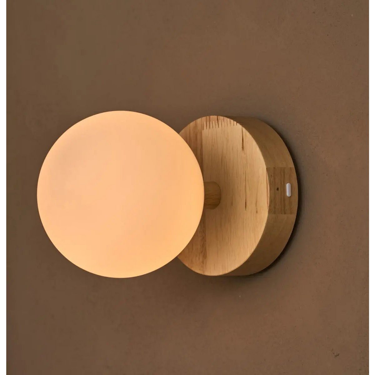Richella wall lamp mounted above headboard in bedroom