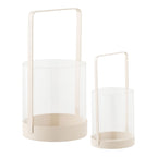 Two cylindrical lanterns with handles on a white background