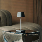 Sarphati rechargeable lamp in hotel lobby setting