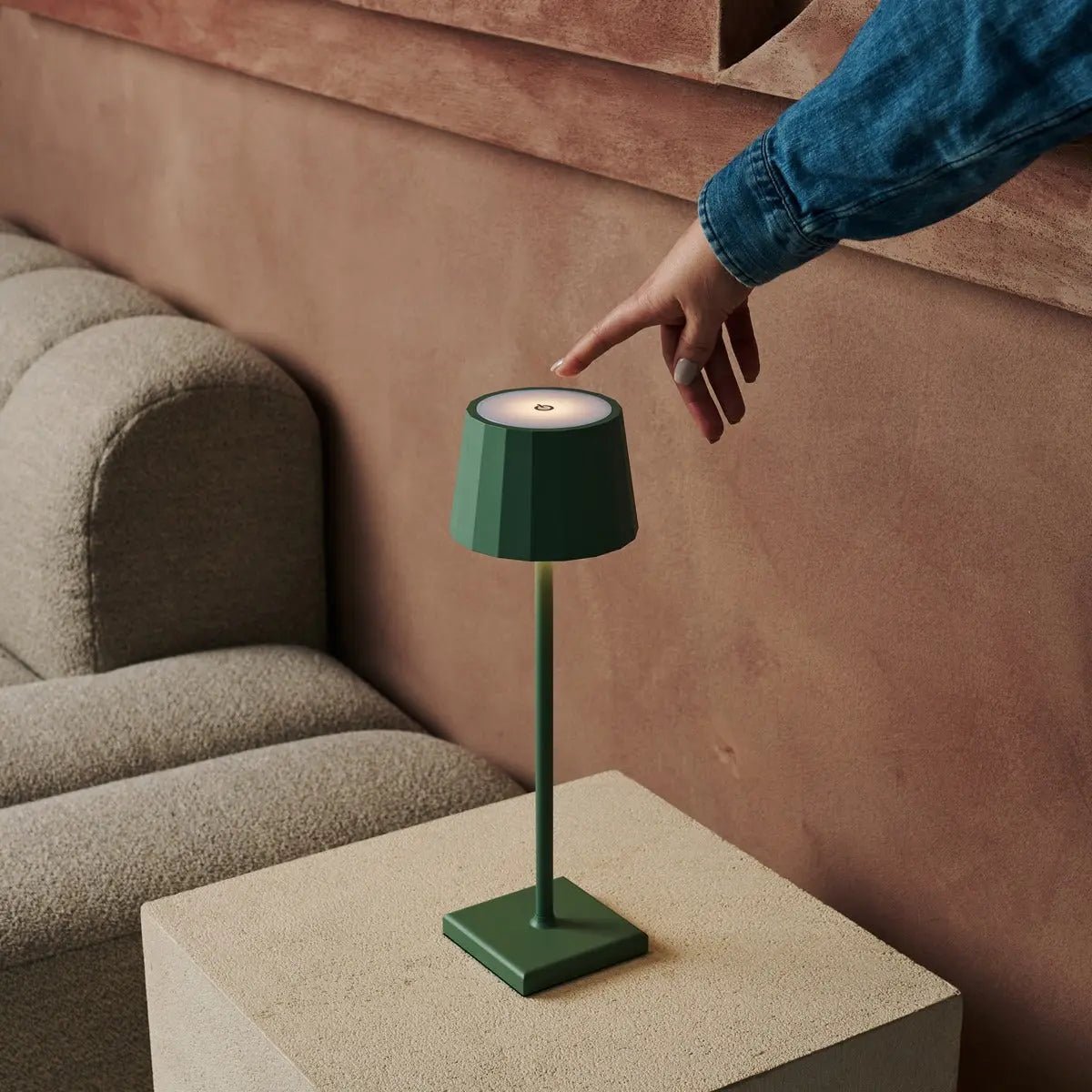 Wouter cordless lamp on dining table in ambient light mode