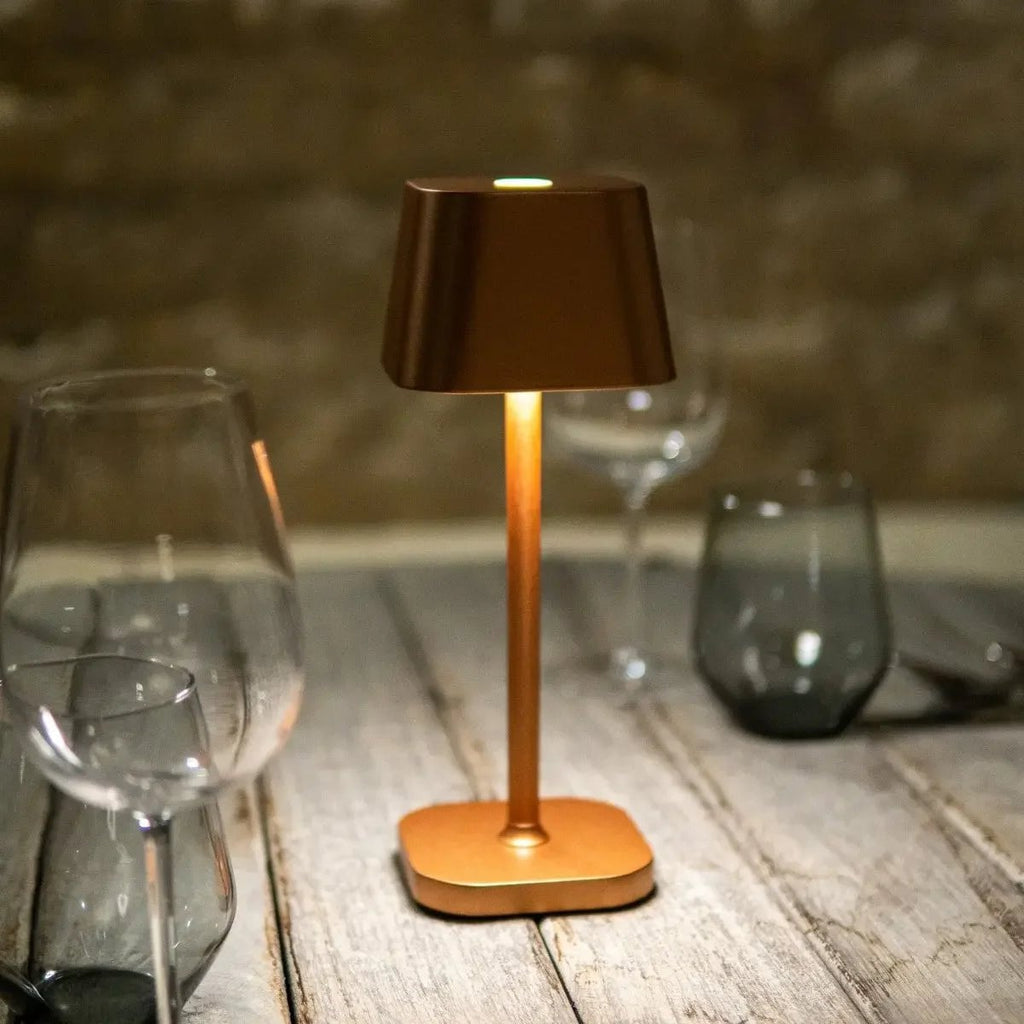 Ava rechargeable lamp warm ambient glow on bedside table