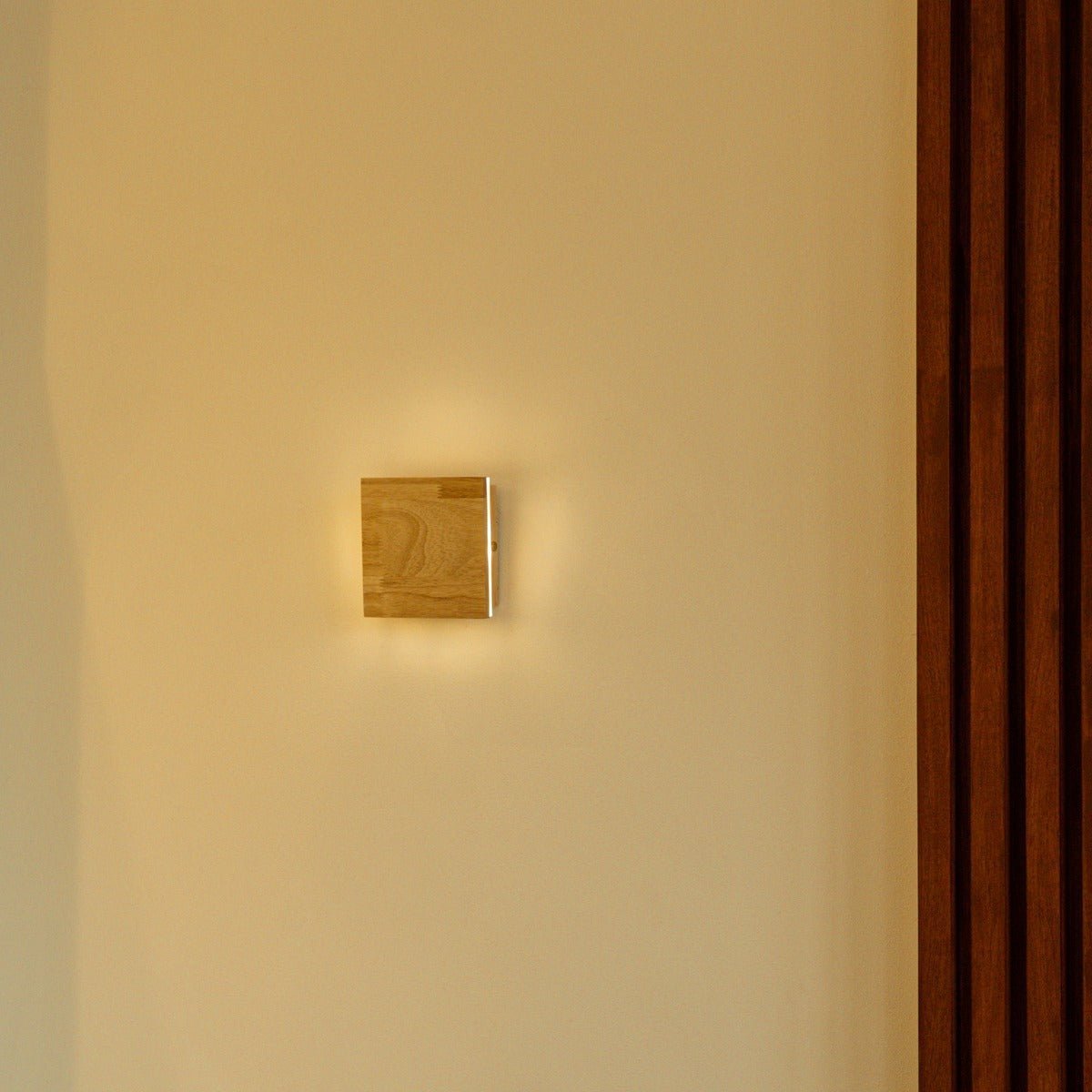 Lane rechargeable wall lamp in bedroom above headboard