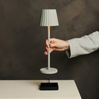 Maya shadow grey metal lamp on hotel console table