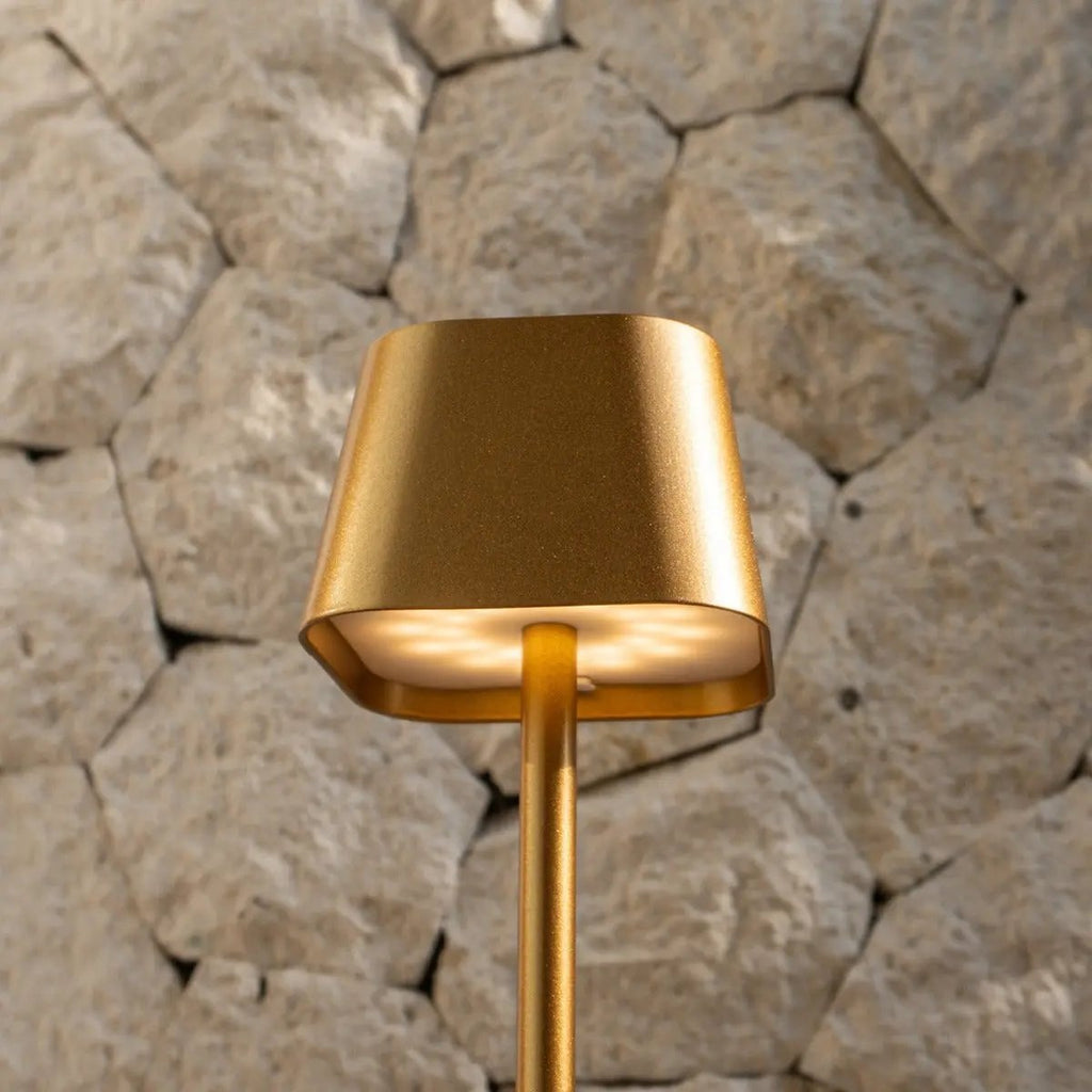 Ava rechargeable lamp warm ambient glow on bedside table