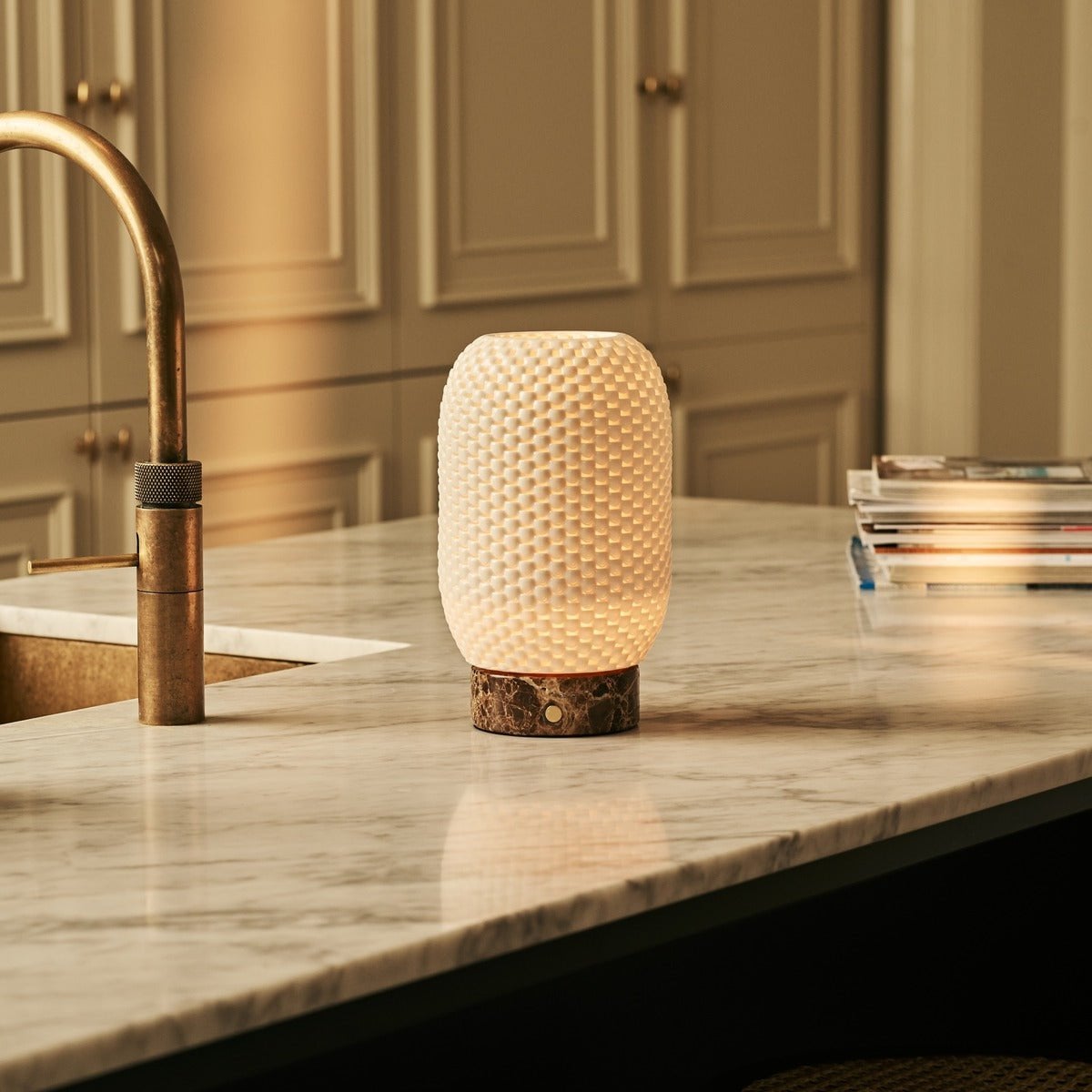 Aurora marble lamp warm glow through porcelain in room setting