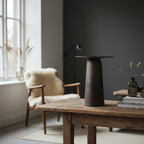 Tall ULFUR ceramic vase as centrepiece on a dining table in a warm moody Nordic interior