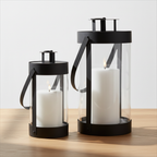 Set of two Bondi black steel and glass lanterns on oak surface with soft daylight and clean off-white background