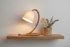 Touw rope lamp on oak shelf with woven basket and dried botanicals