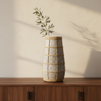 The Cutie Concrete Rattan Vase L op walnoot dressoir met olijftak