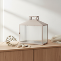 Lucca beige grey metal glass lantern on a mantelpiece in a Nordic interior with dried botanical styling
