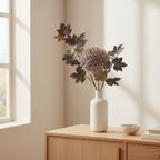 Faux natural bouquet in tall ceramic vase on a Nordic sideboard with soft natural light