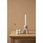 Bello stoneware candle holder on oak side table, limewash wall