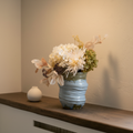 Azure Bloom Light Blue Ceramic Vase on oak console with limewash wall