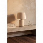 Tavira Ceramic Corded Table Lamp on concrete console