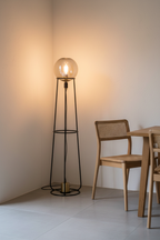 Stelo retro wire cage floor lamp in dining room corner beside wooden chair