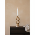 Soren Brown Ceramic Stacked Candle Holder on walnut sideboard with limewash wall