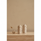 Rugo Beige Cement Decorative Object on travertine console with limewash wall