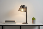 Korie black wire mesh lamp on marble console with books and small plant