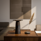 ULFUR ceramic vase on a sideboard in a warm Nordic interior with dried stem and stone object