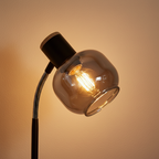 Fumoso lamp close-up detail of smoked glass globe shade with warm filament glow